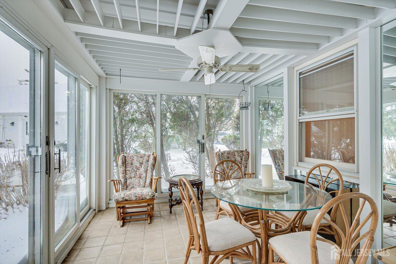628A Windsor Way, Unit B Monroe Township, NJ 08831 - Photo 21 of 50 a view of a dining room with furniture window and outside view