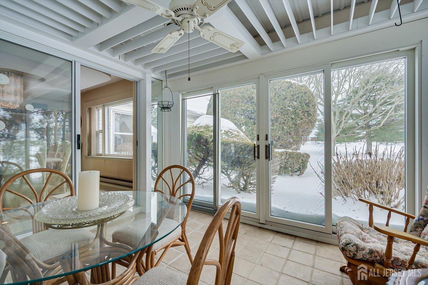 628A Windsor Way, Unit B Monroe Township, NJ 08831 - Photo 22 of 50 a dining room with furniture a chandelier and wooden floor