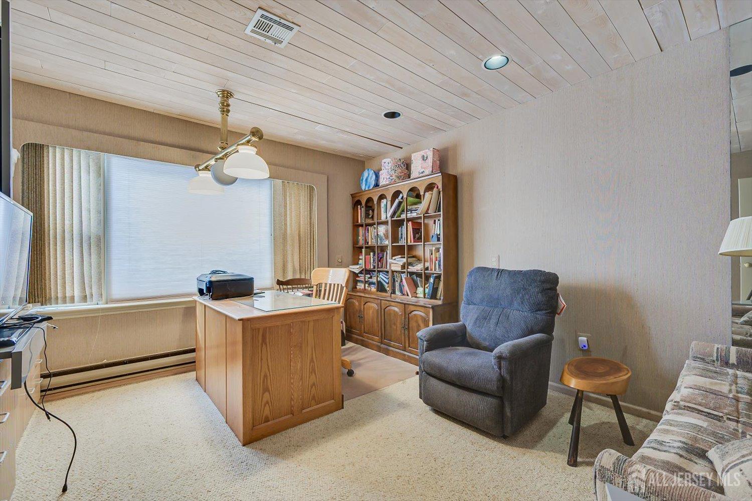 628A Windsor Way, Unit B Monroe Township, NJ 08831 - Photo 29 of 50 a living room with furniture and a window