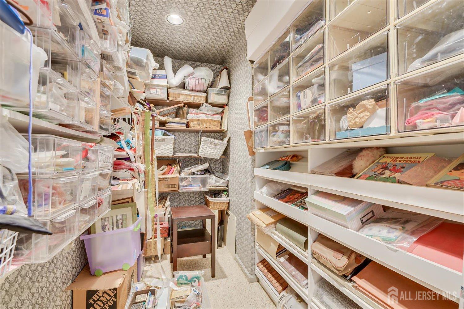 628A Windsor Way, Unit B Monroe Township, NJ 08831 - Photo 31 of 50 a cabinet with white walls and a book shelf