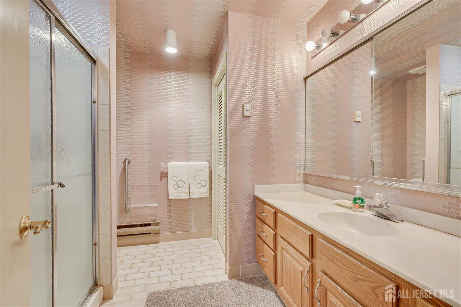 628A Windsor Way, Unit B Monroe Township, NJ 08831 - Photo 32 of 50 a bathroom with a sink a toilet and shower