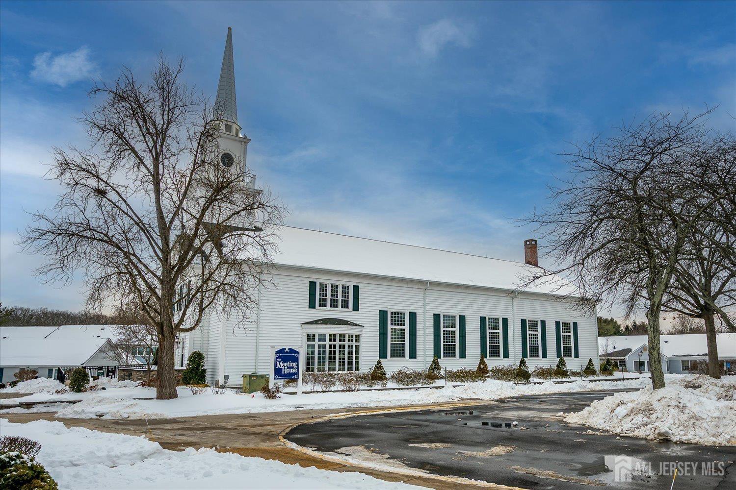 628A Windsor Way, Unit B Monroe Township, NJ 08831 - Photo 50 of 50 a front view of a building with trees