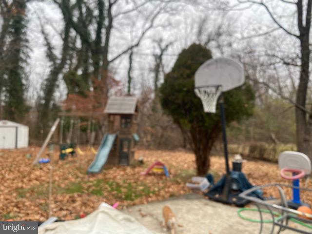 29 Parkside Circle Willingboro, NJ 08046 - Photo 8 of 9 a picture of a tree in a backyard