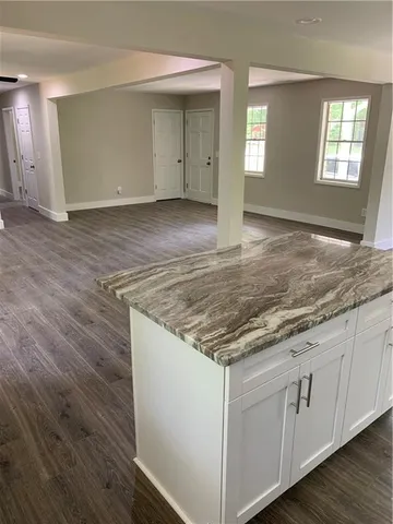 a view of a kitchen sink cabinets and wooden floor