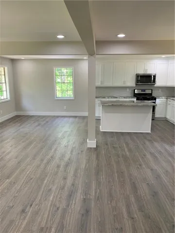 a view of kitchen with microwave and window