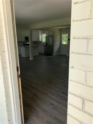 a view of a kitchen from the hallway