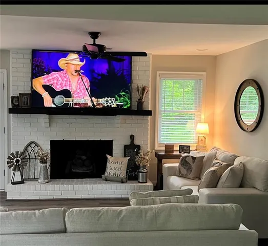 a living room with furniture and a fireplace