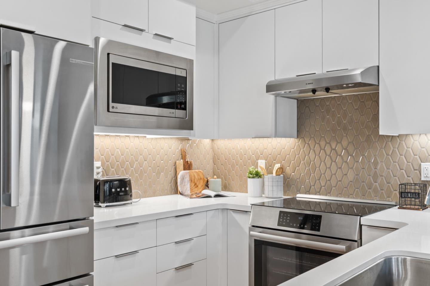 1383 West Middlefield Road Mountain View, CA 94043 - Photo 12 of 33 a kitchen with appliances and cabinets