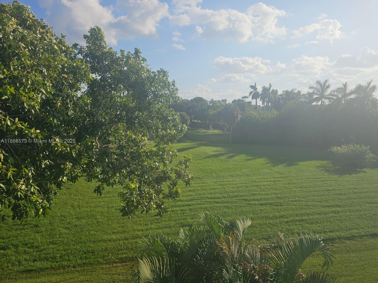 6782 Brookline Drive, Unit 6782 Hialeah, FL 33015 - Photo 25 of 27 a view of a lake from a yard