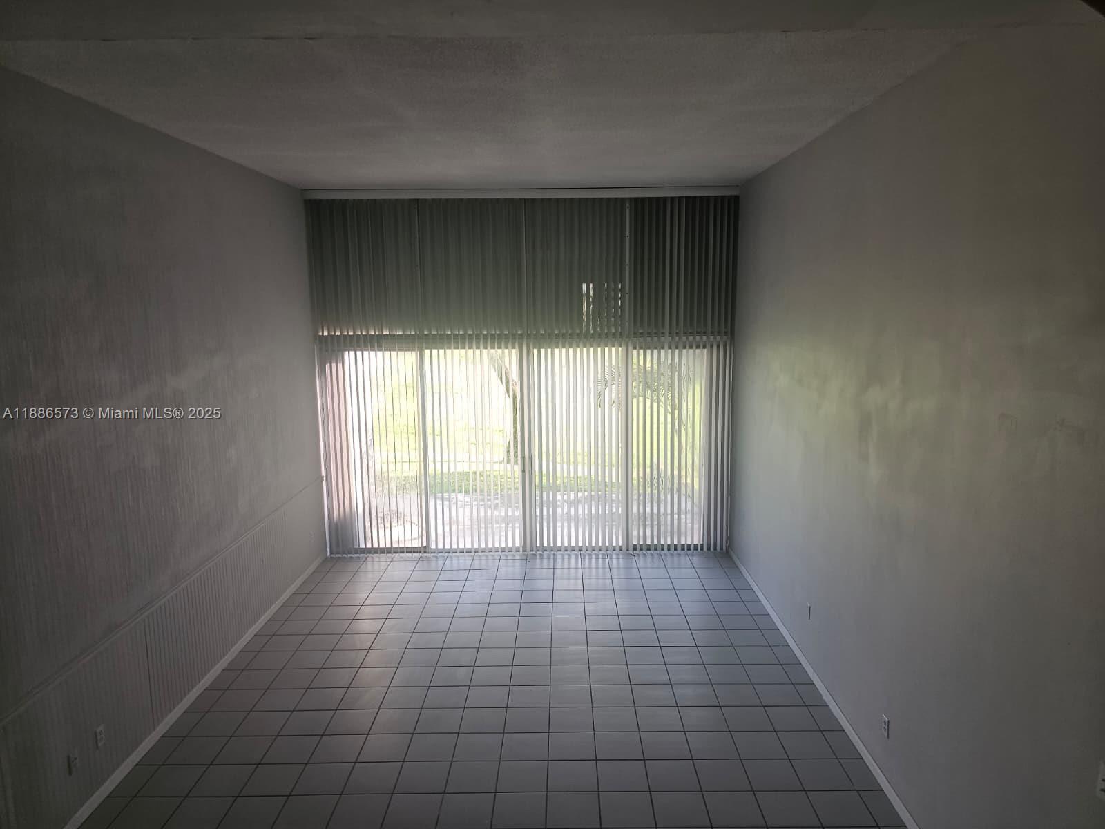 6782 Brookline Drive, Unit 6782 Hialeah, FL 33015 - Photo 26 of 27 a view of an empty room and window
