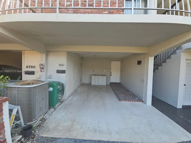 a view of a kitchen with furniture and window