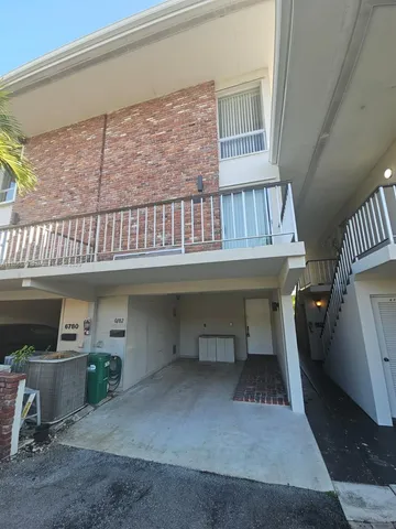 a view of a livingroom with furniture and staircase