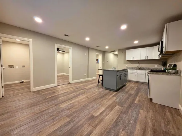 a view of kitchen with wooden floor