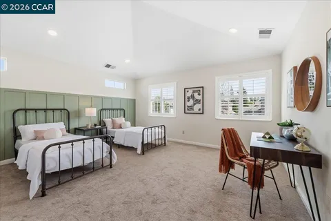 a bedroom with bed and a window