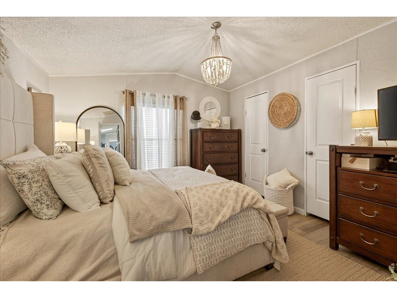 8410 Madison Way Denver, CO 80229 - Photo 11 of 40 Bright and spacious primary bedroom designed for comfort.