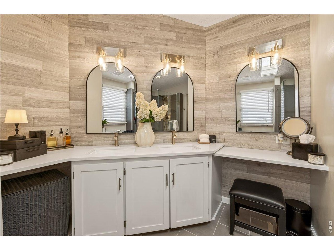 8410 Madison Way Denver, CO 80229 - Photo 15 of 40 Dual vanity setup offers convenience with modern fixtures and ample space for getting ready.