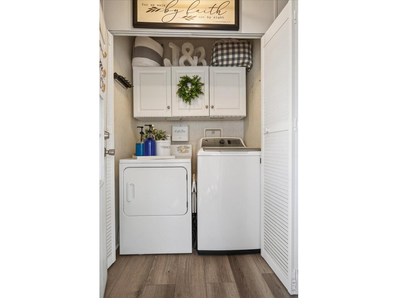 8410 Madison Way Denver, CO 80229 - Photo 18 of 40 Laundry area includes full-size appliances and extra storage cabinetry.