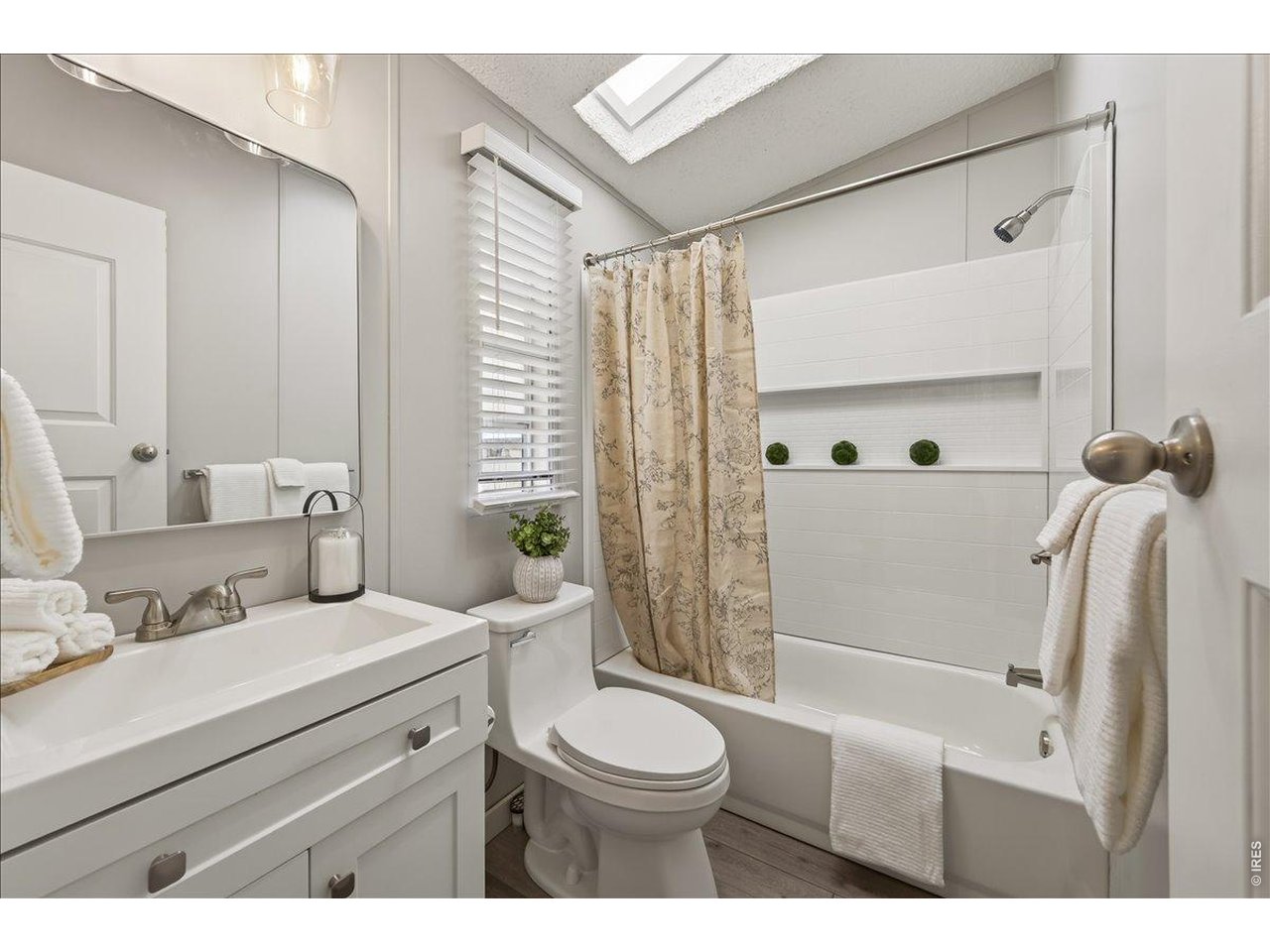 8410 Madison Way Denver, CO 80229 - Photo 19 of 40 Functional and updated bathroom for guest or family members.