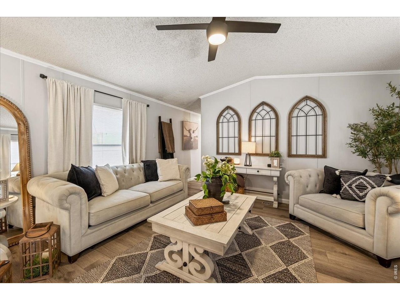 8410 Madison Way Denver, CO 80229 - Photo 2 of 40 Spacious living area designed for both everyday comfort and entertaining.