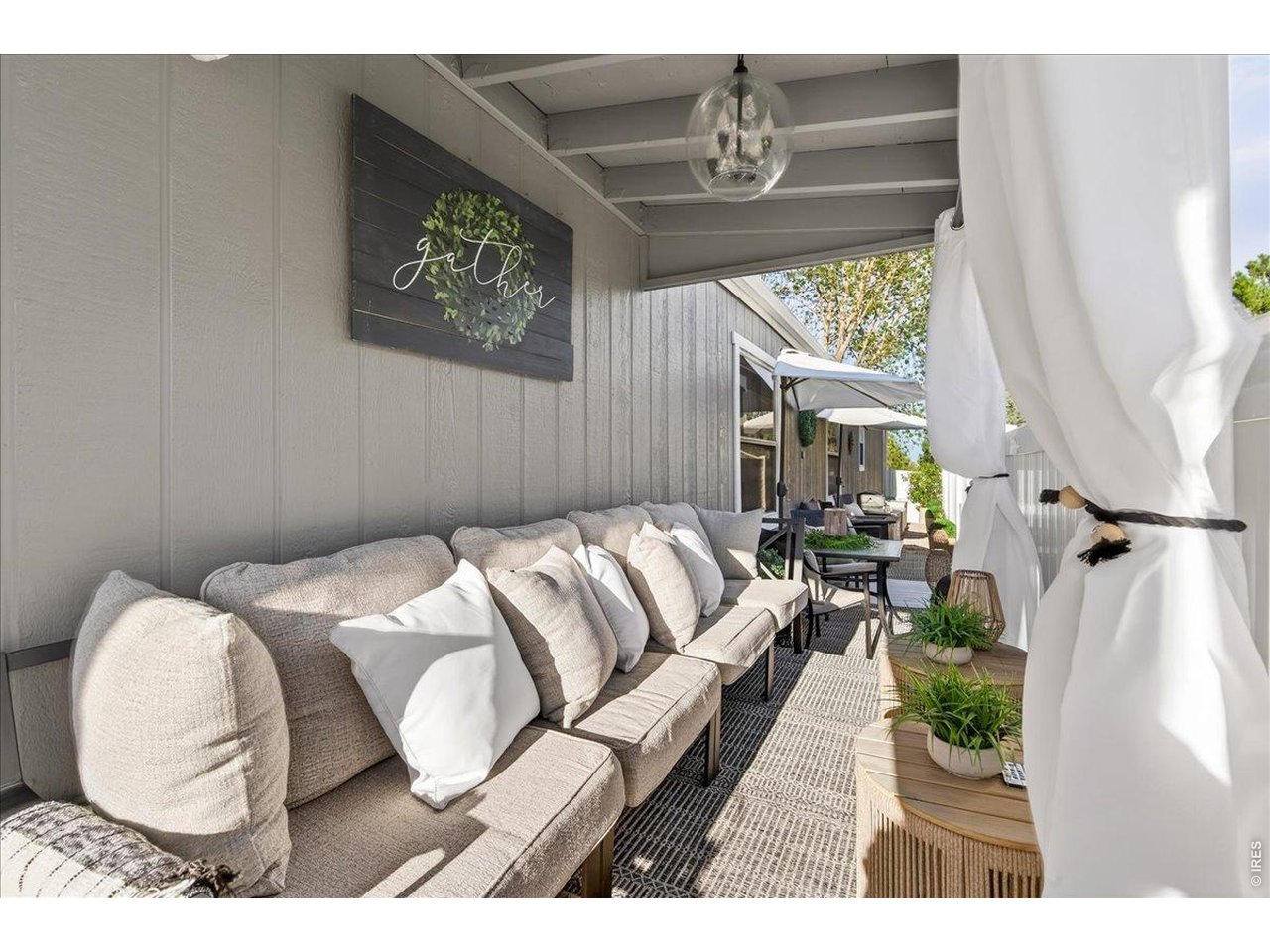 8410 Madison Way Denver, CO 80229 - Photo 21 of 40 Thoughtfully designed outdoor seating areas create a comfortable extension of the home.