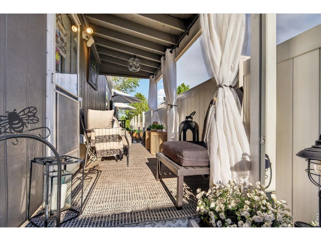 8410 Madison Way Denver, CO 80229 - Photo 23 of 40 The covered patio offers shade and comfort-perfect for enjoying Colorado's seasons.