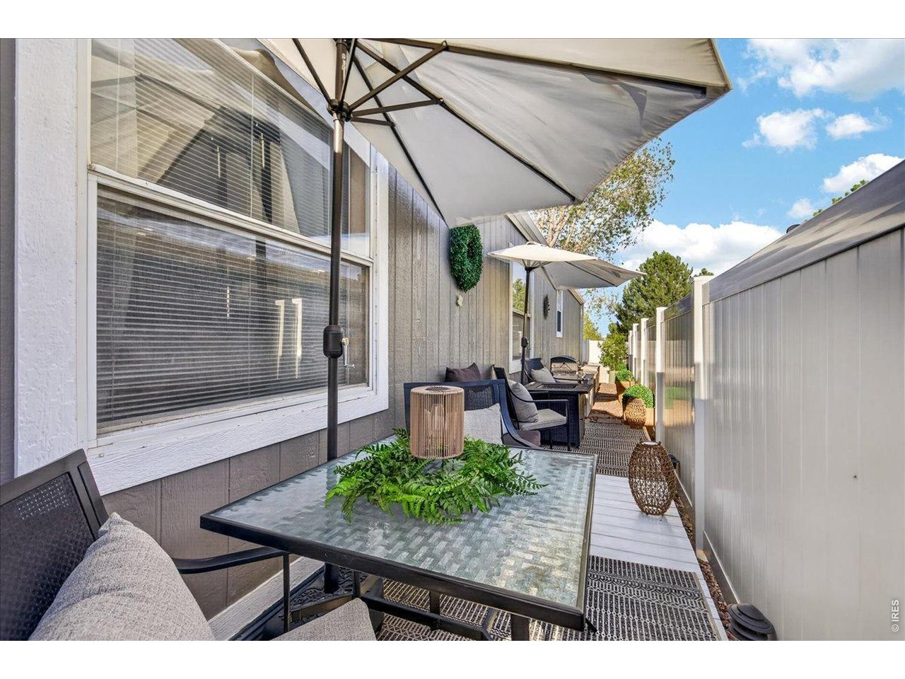 8410 Madison Way Denver, CO 80229 - Photo 24 of 40 Dedicated dining space outdoors creates the perfect hosting environment.