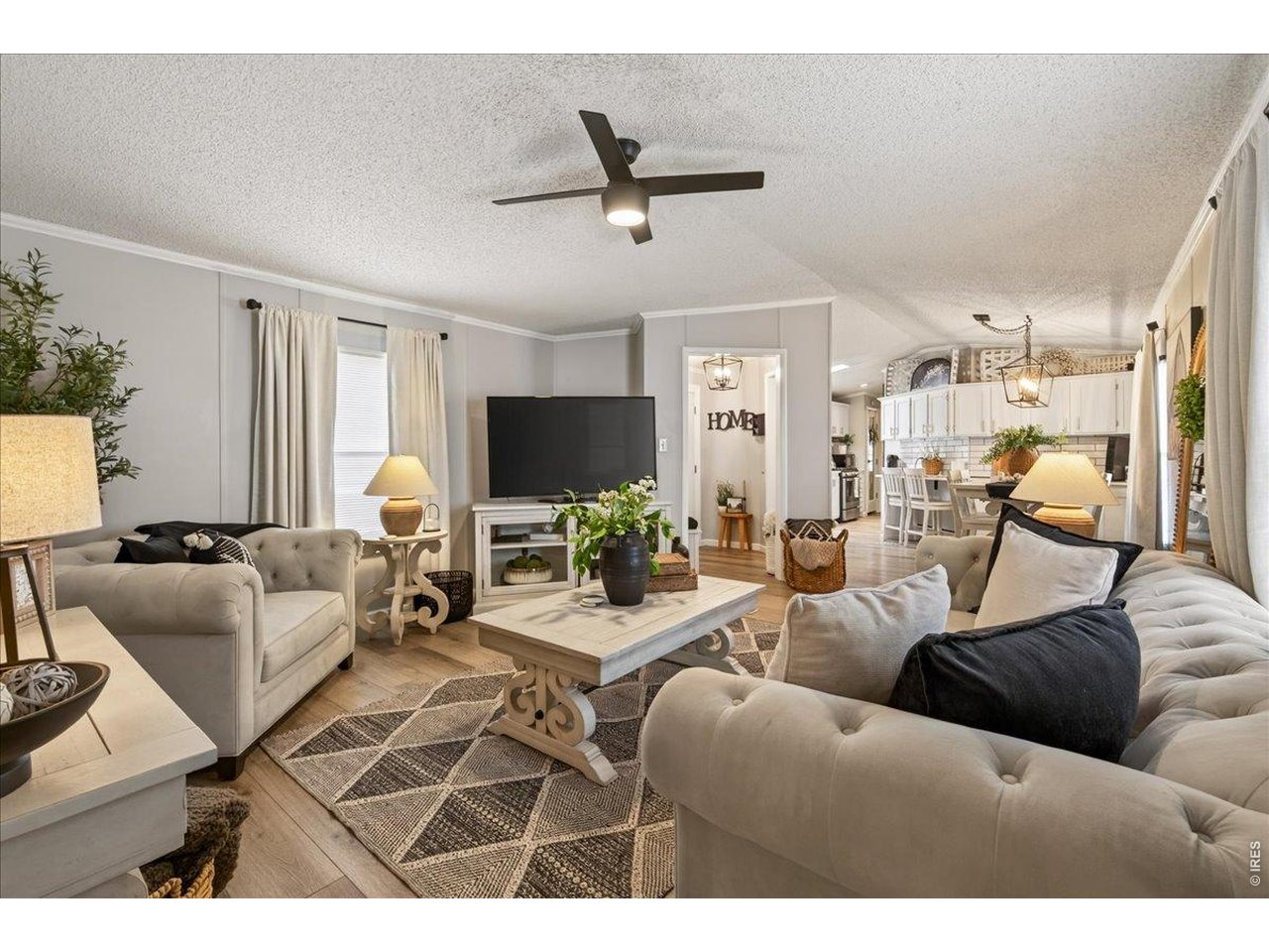 8410 Madison Way Denver, CO 80229 - Photo 4 of 40 Bright, open interiors showcase cohesive finishes and an inviting atmosphere throughout.