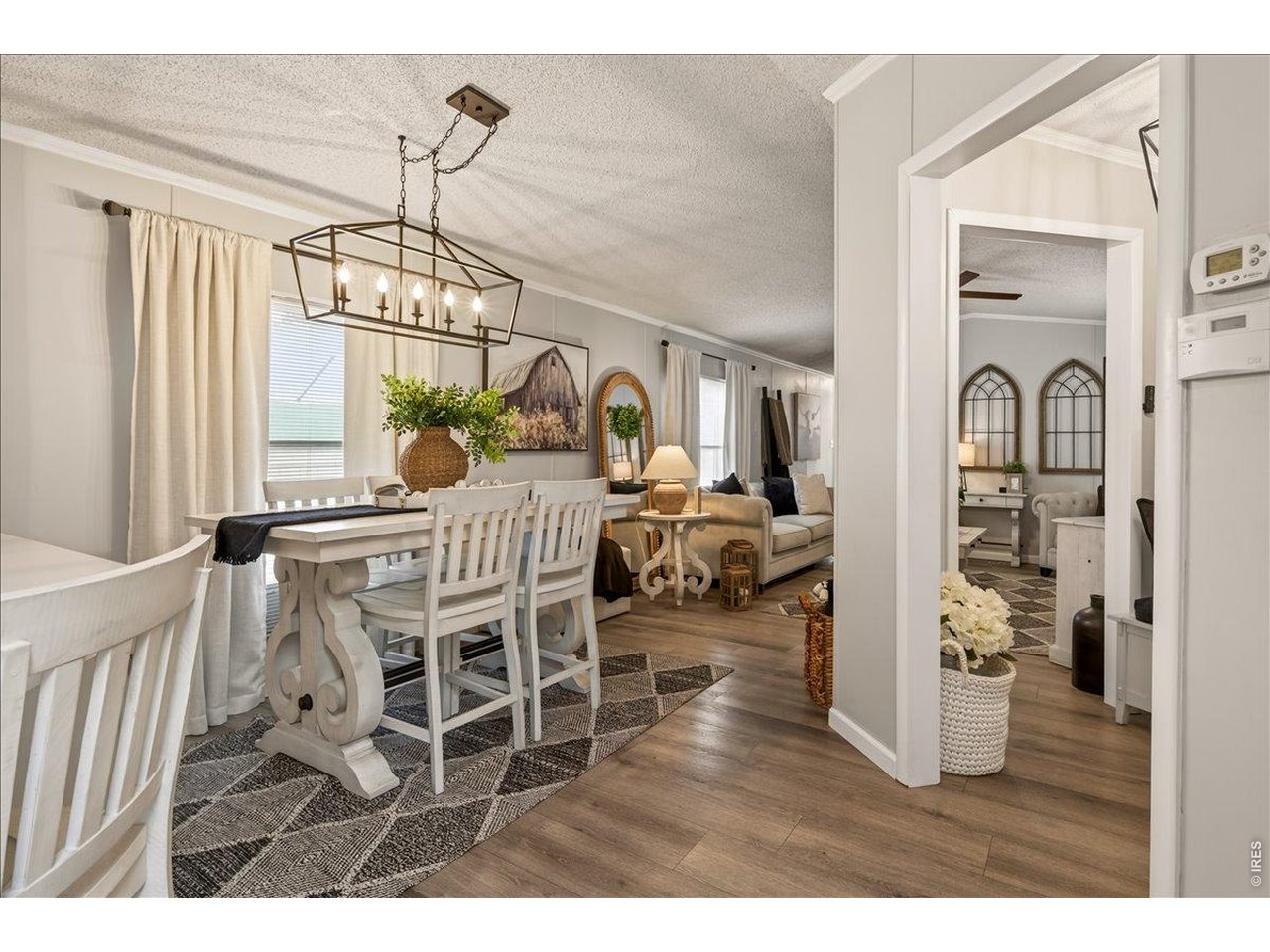 8410 Madison Way Denver, CO 80229 - Photo 5 of 40 The main living area flows effortlessly into the kitchen and dining space.