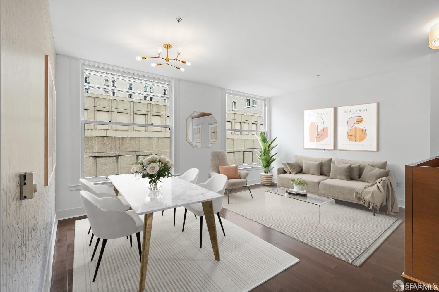 a living room with furniture wooden floor and a large window