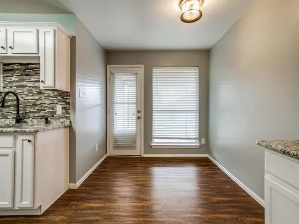 a view of a kitchen from the hallway