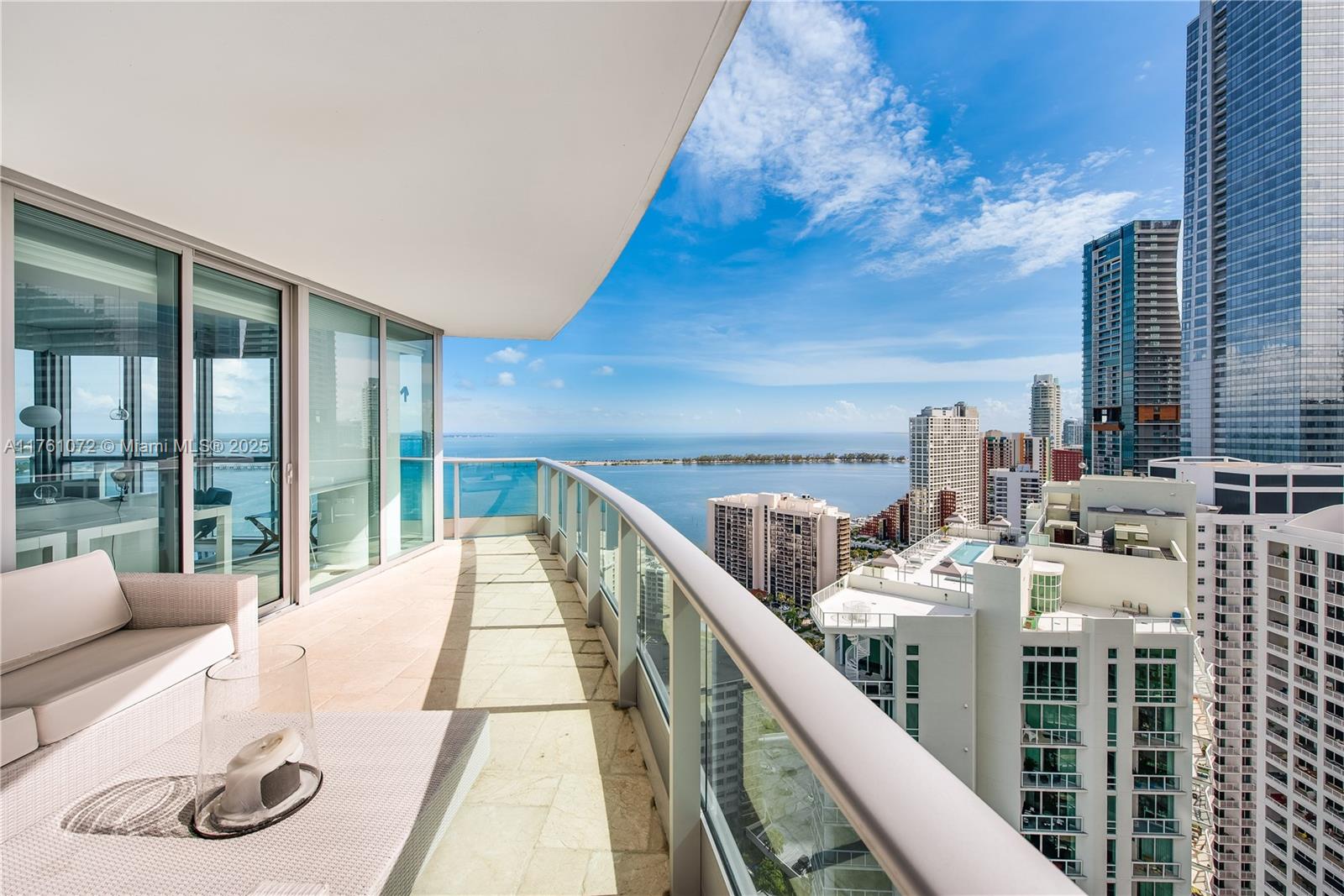 1331 Brickell Bay Drive, Unit 3311 Miami, FL 33131 - Photo 16 of 43 a balcony with furniture and a large window