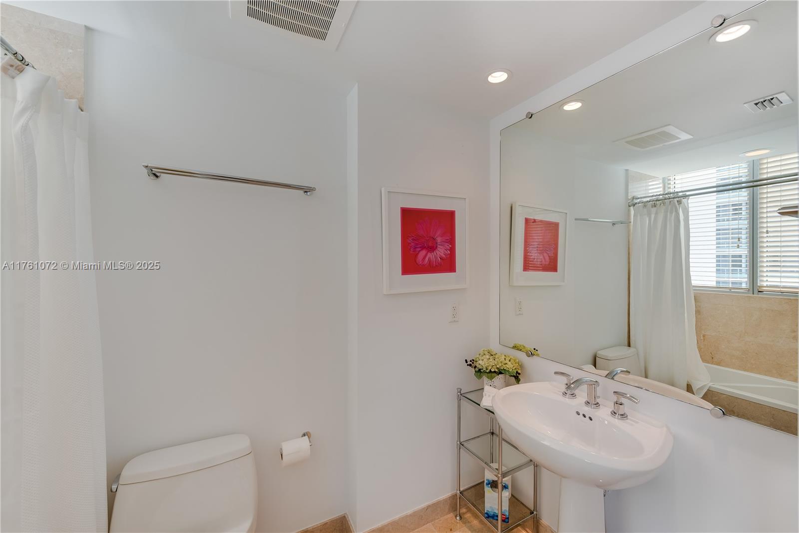 1331 Brickell Bay Drive, Unit 3311 Miami, FL 33131 - Photo 20 of 43 a bathroom with a sink and a mirror