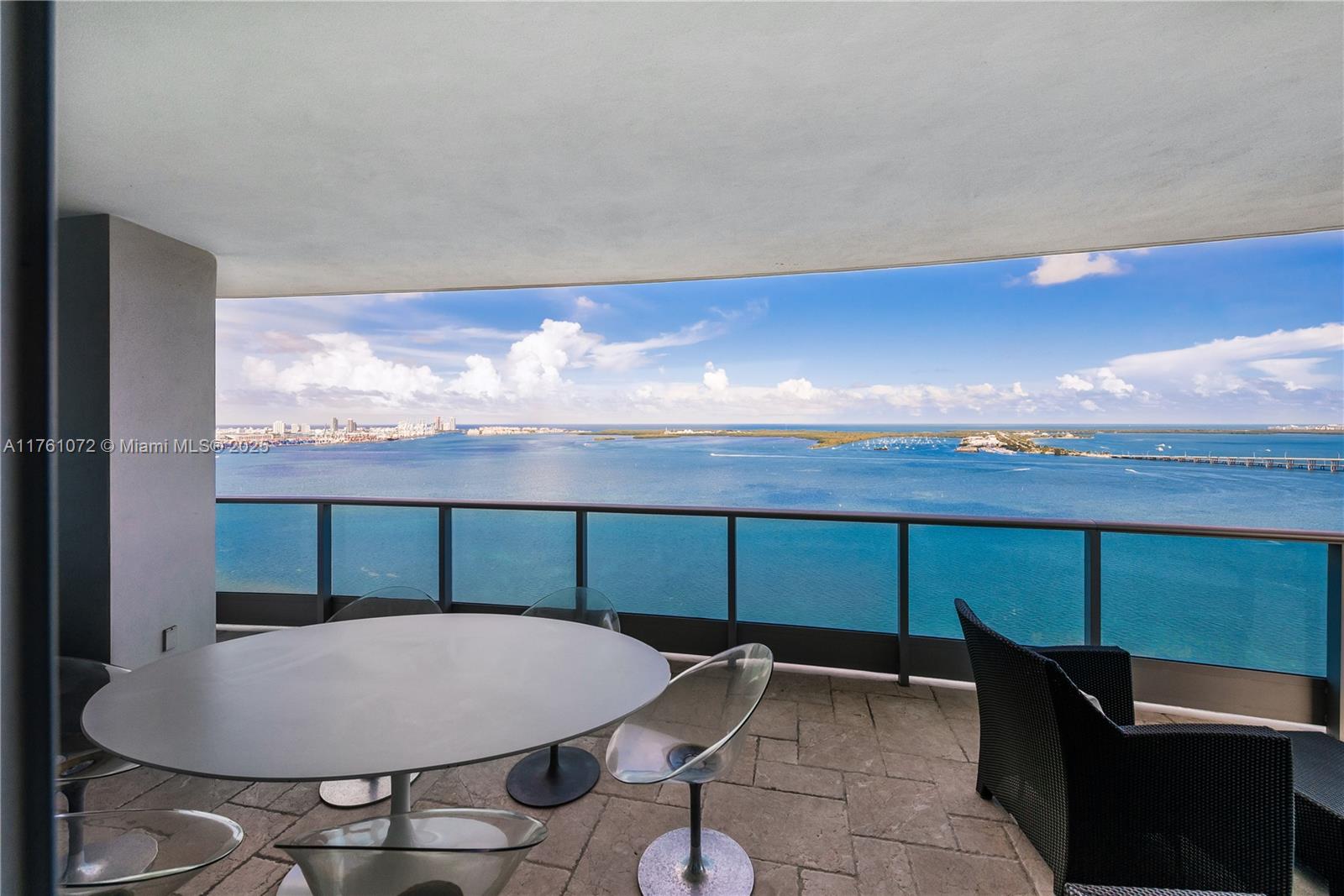 1331 Brickell Bay Drive, Unit 3311 Miami, FL 33131 - Photo 28 of 43 a view of a balcony with chair and table