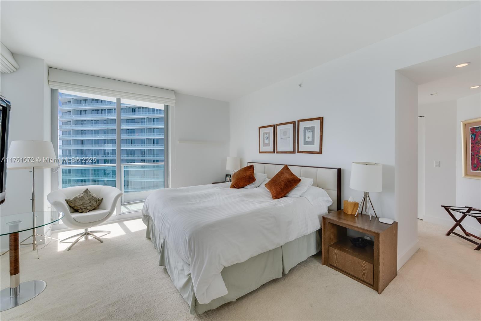 1331 Brickell Bay Drive, Unit 3311 Miami, FL 33131 - Photo 3 of 43 a bedroom with a bed and a window