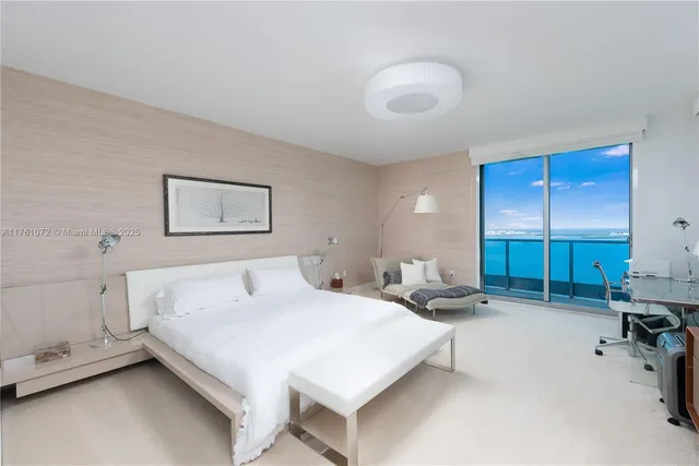 a bedroom with furniture and a window