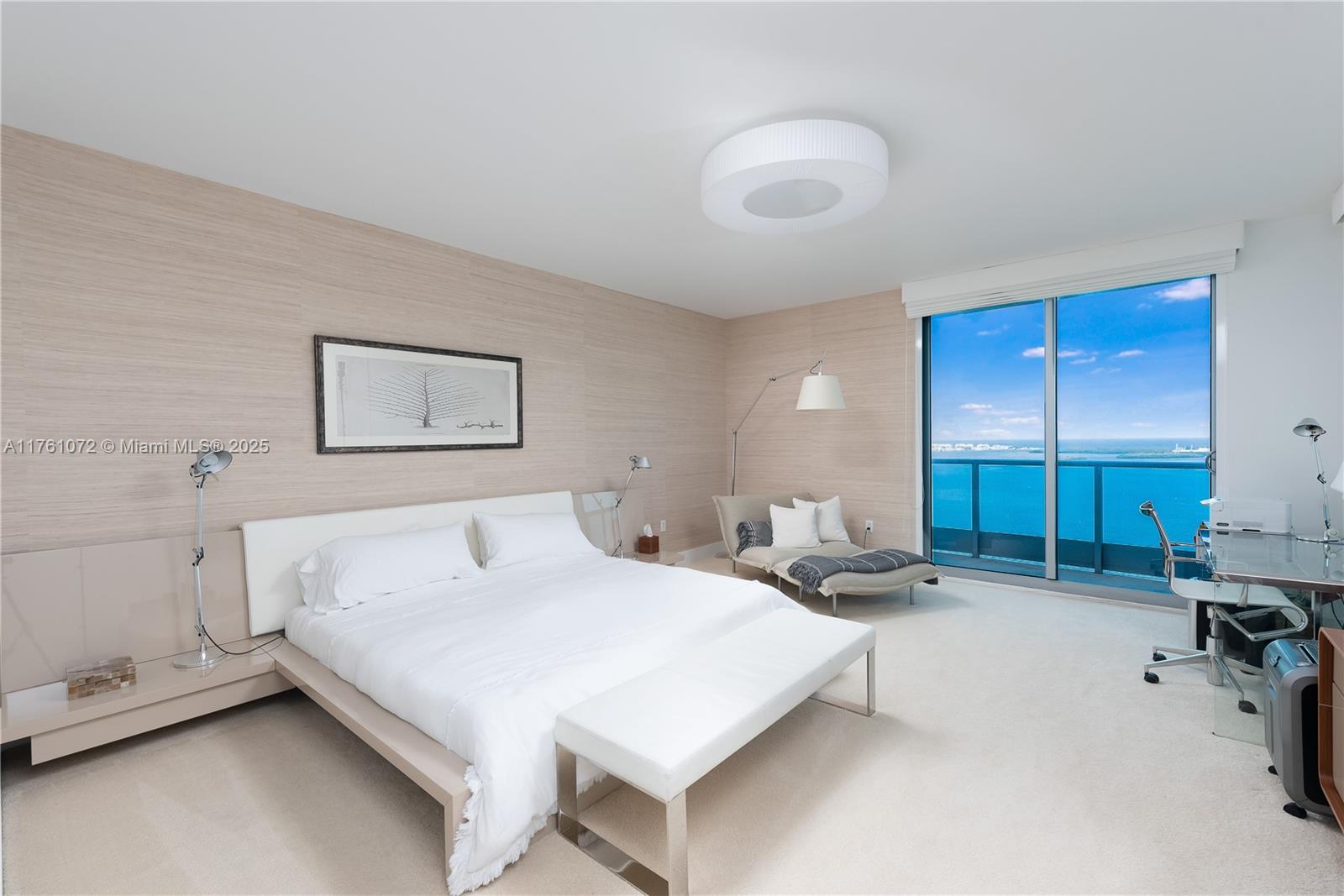 1331 Brickell Bay Drive, Unit 3311 Miami, FL 33131 - Photo 39 of 43 a bedroom with a bed and a chair