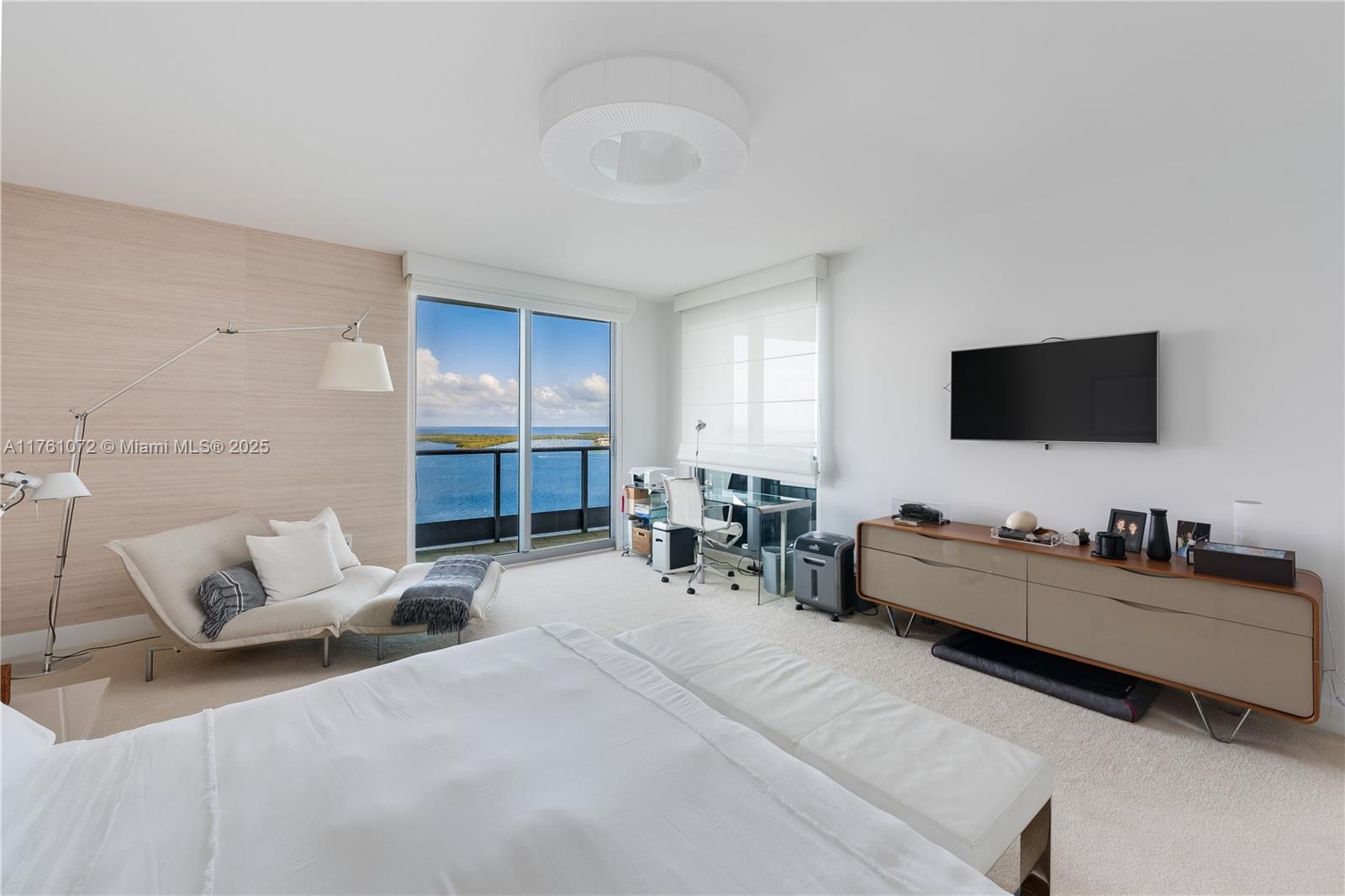 1331 Brickell Bay Drive, Unit 3311 Miami, FL 33131 - Photo 41 of 43 a living room with furniture and a flat screen tv