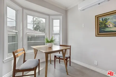 a view of a dining room with furniture window and outside view