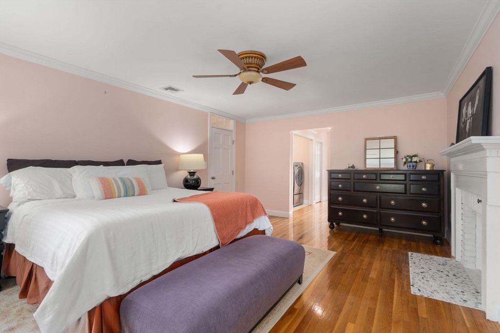 24 Russett Hill Road Sherborn, MA 01770 - Photo 18 of 39 a bedroom with a bed and wooden floor