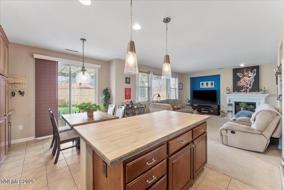 10755 Copper Lake Drive Reno, NV 89521 - Photo 11 of 40 a living room with furniture a table and chairs