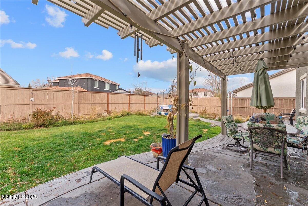 10755 Copper Lake Drive Reno, NV 89521 - Photo 32 of 40 a view of a patio with a table and chairs