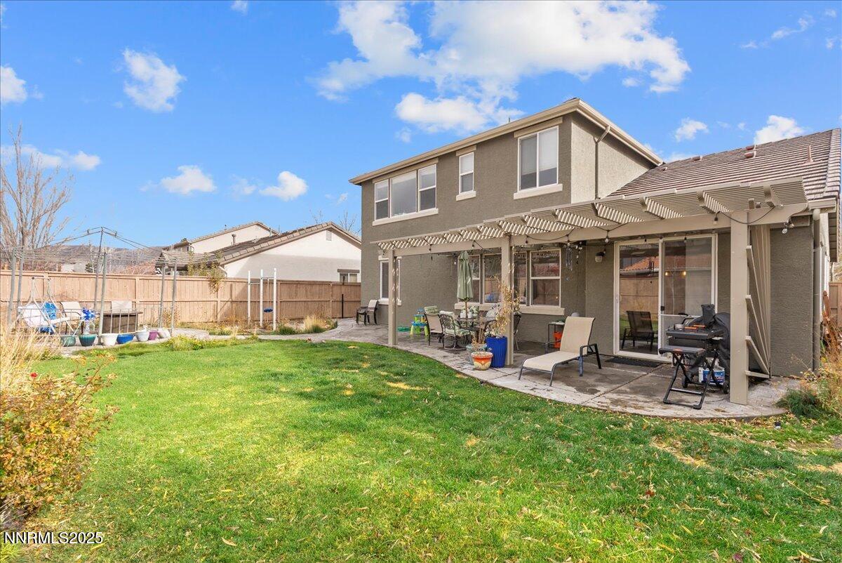 10755 Copper Lake Drive Reno, NV 89521 - Photo 37 of 40 a front view of a house with sitting area and garden