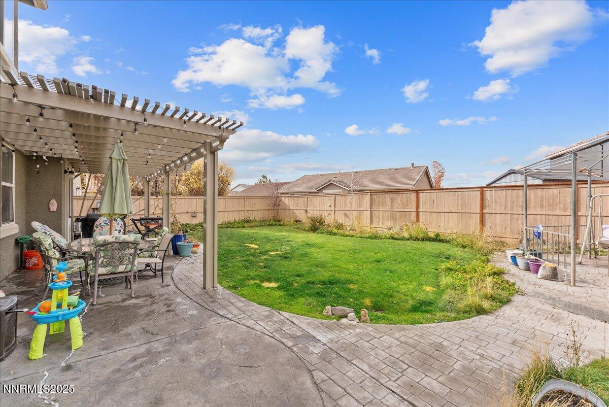 10755 Copper Lake Drive Reno, NV 89521 - Photo 40 of 40 a view of a chairs and table in a backyard