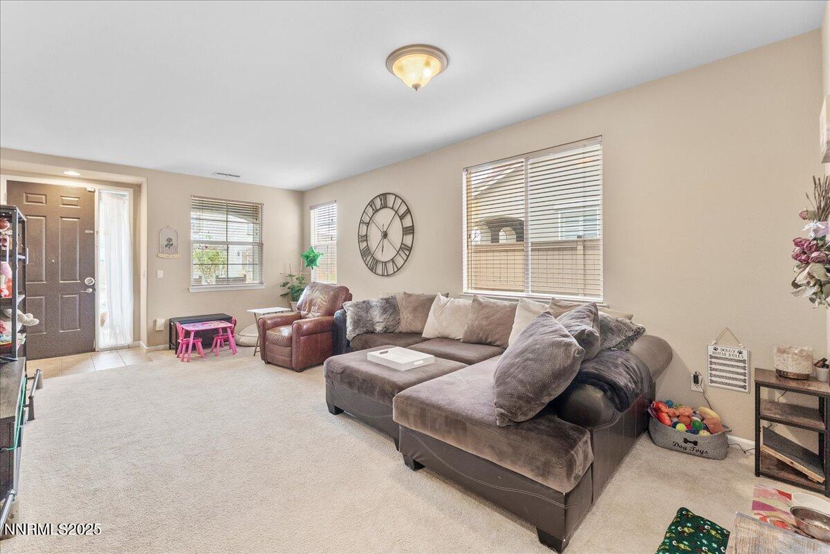10755 Copper Lake Drive Reno, NV 89521 - Photo 4 of 40 a living room with furniture a table and a large window