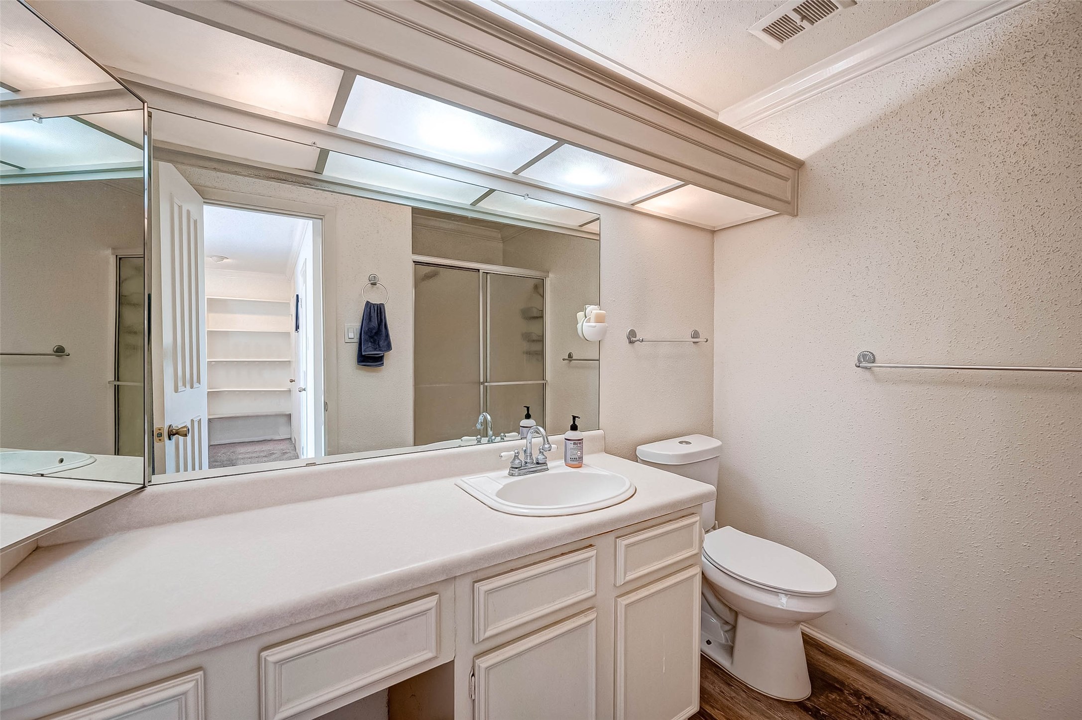 1908 Augusta Drive, Unit 7 Houston, TX 77057 - Photo 24 of 33 a bathroom with a sink a toilet and shower