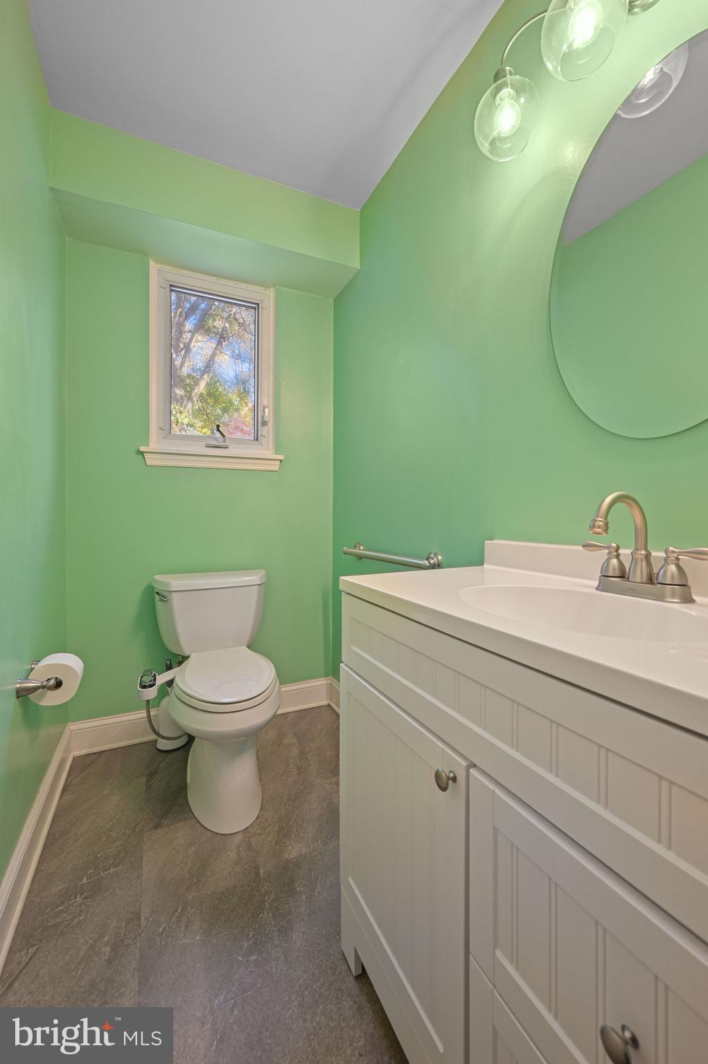 210 Cambridge Road Camden Wyoming, DE 19934 - Photo 17 of 35 a bathroom with a toilet sink and mirror