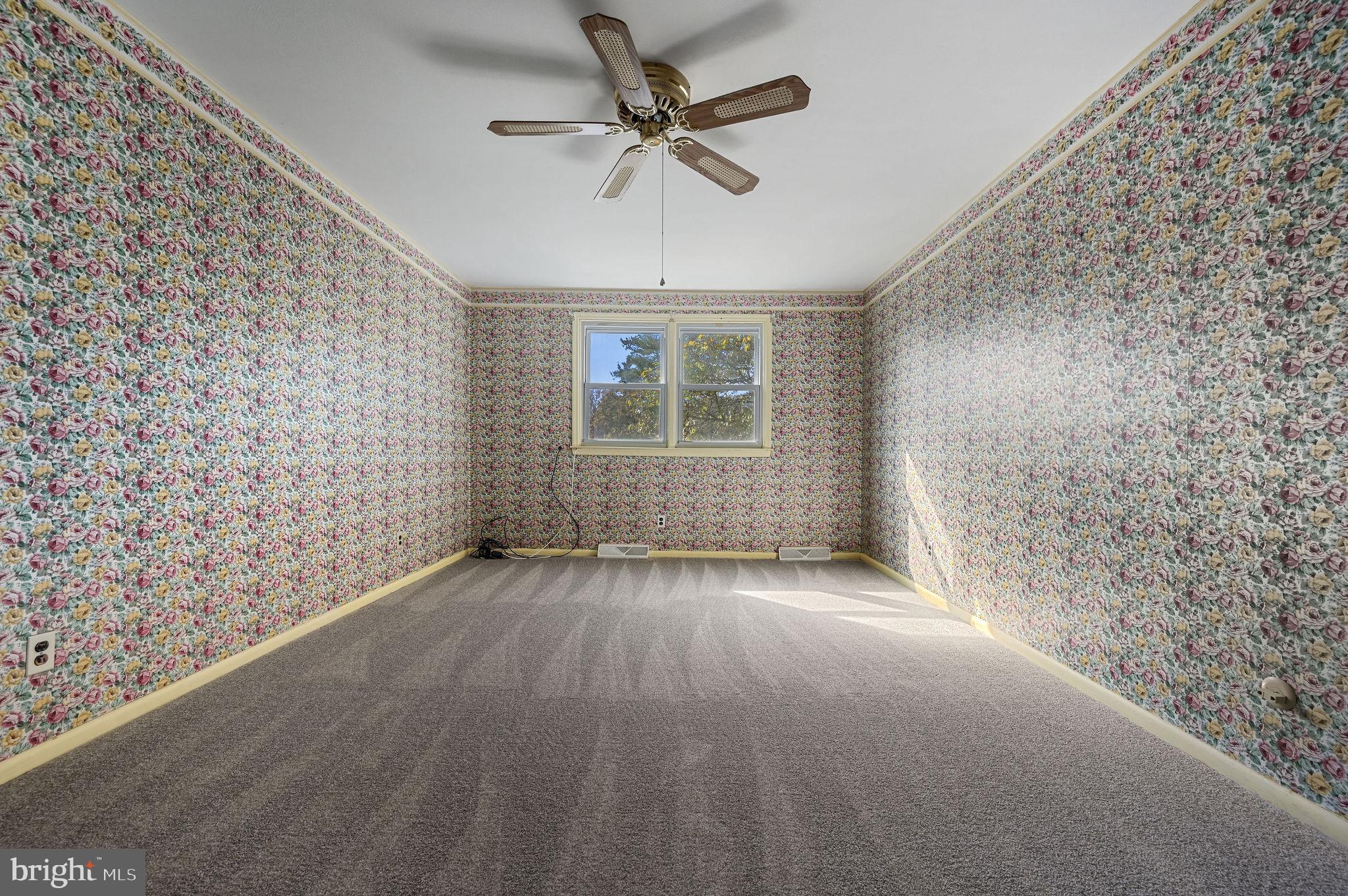 210 Cambridge Road Camden Wyoming, DE 19934 - Photo 18 of 35 wooden floor in an empty room with a window