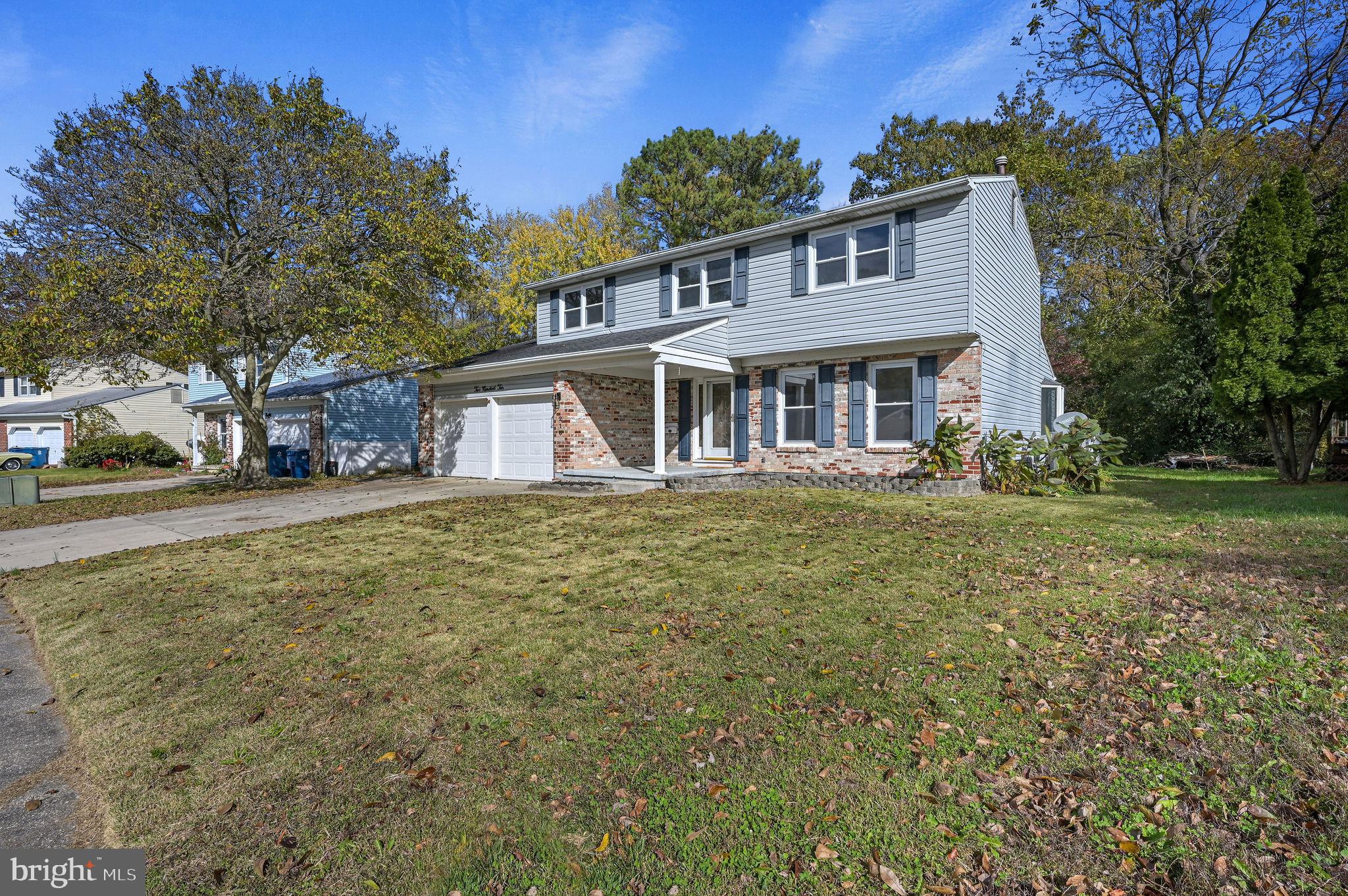 210 Cambridge Road Camden Wyoming, DE 19934 - Photo 2 of 35 a front view of a house with a garden