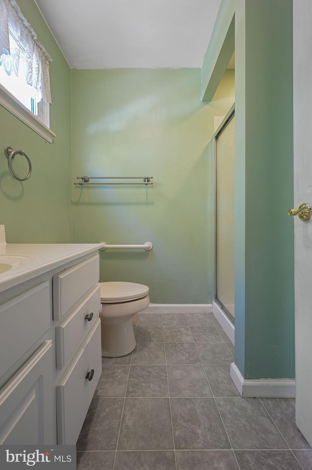 210 Cambridge Road Camden Wyoming, DE 19934 - Photo 21 of 35 a bathroom with a toilet a sink and a mirror