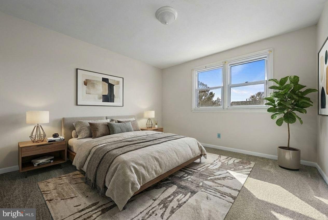 210 Cambridge Road Camden Wyoming, DE 19934 - Photo 31 of 35 a bedroom with a bed a couch and potted plant